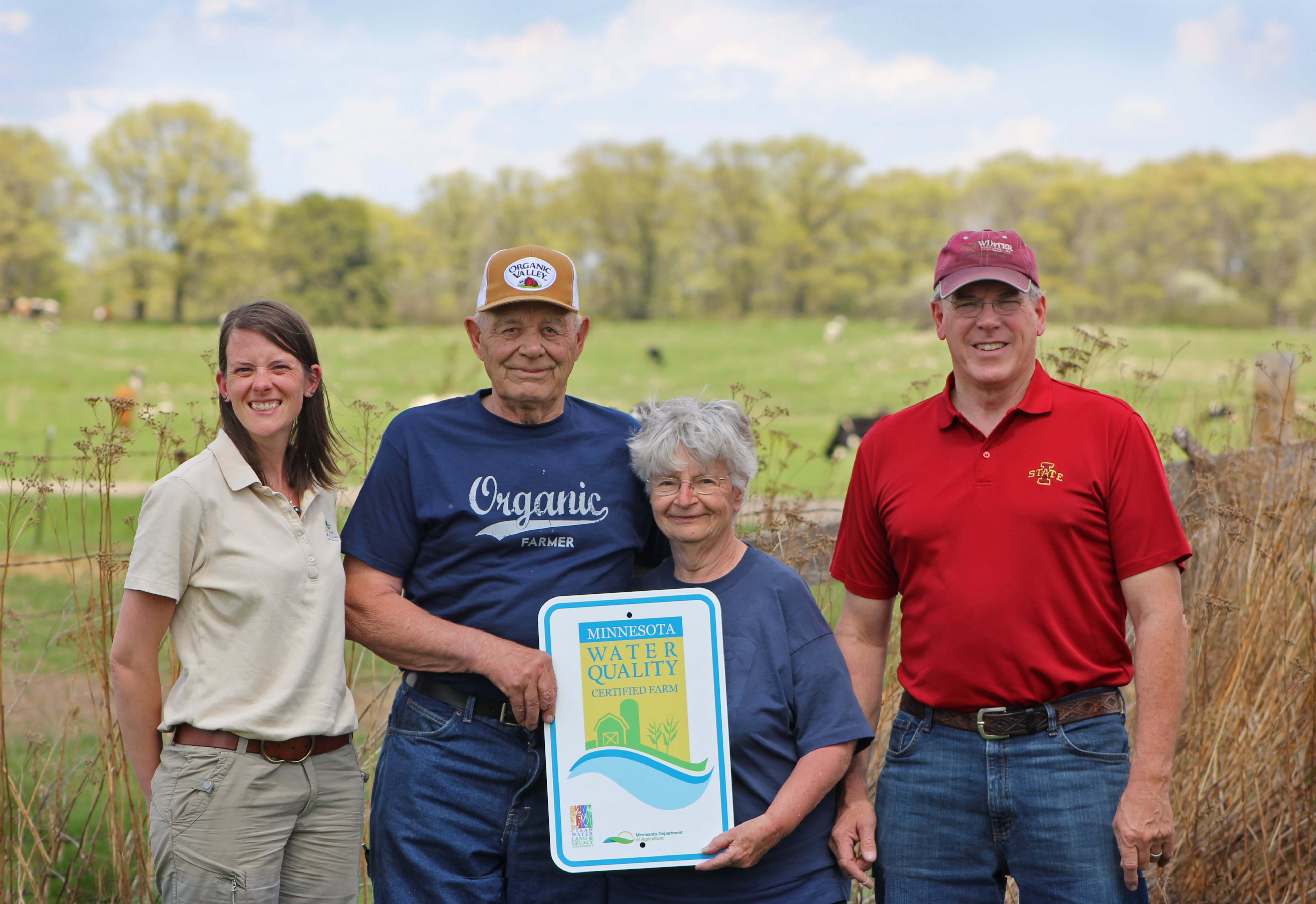 MN Agricultural Water Quality Certification Program (MAWQCP) certified farmer with MAWQCP sign