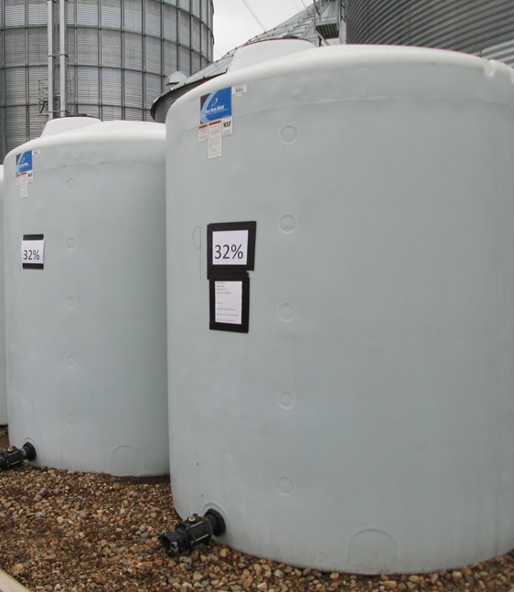 On-farm storage of two poly fertilizer tanks. 