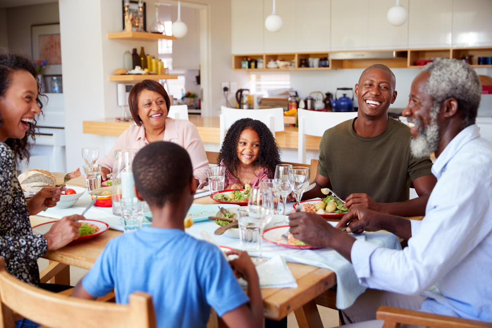 A family sitting around a table of food