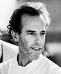 dark-haired man in a chef's coat