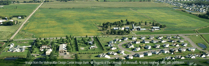 Farmland surrounded by housing developments