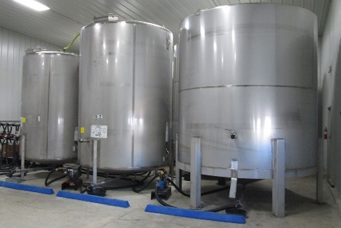 Photo shows stainless steel bulk liquid pesticide tanks. 