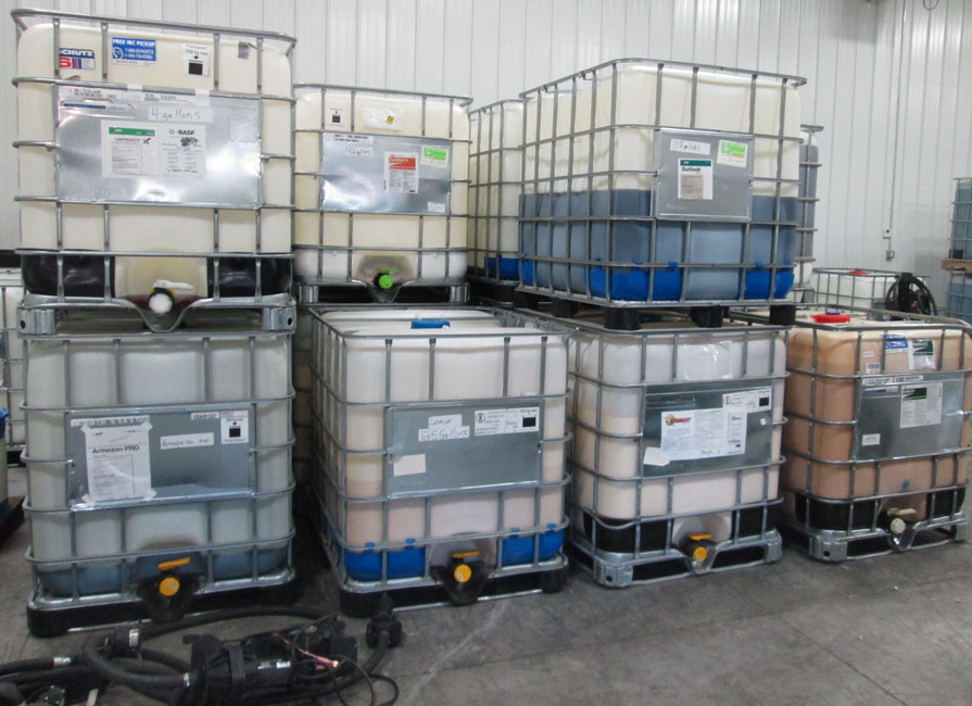 Photo shows pesticide mini-bulks being stored at a facility