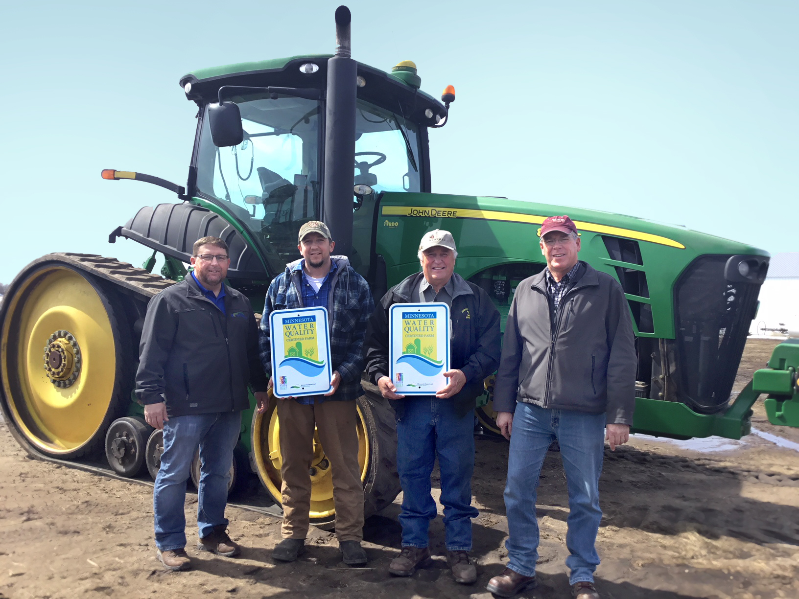 Darren Newville, District Manager at East Otter Tail and Wadena Soil and Water Conservation Districts; MAWQCP certified producers Andrew and Dale Schock; MAWQCP Area Certification Specialist Jim Lahn.