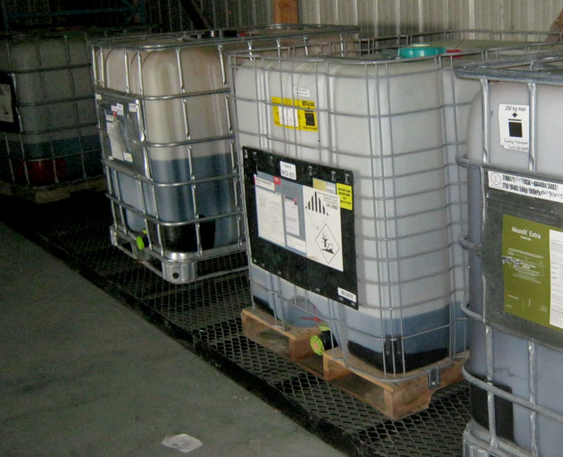 Photo shows pesticide mini-bulks being stored at a facility.  