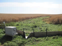 Flume at the edge of the field funneling runoff from the field to be sampled.