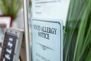 food allergen warning notice on store window