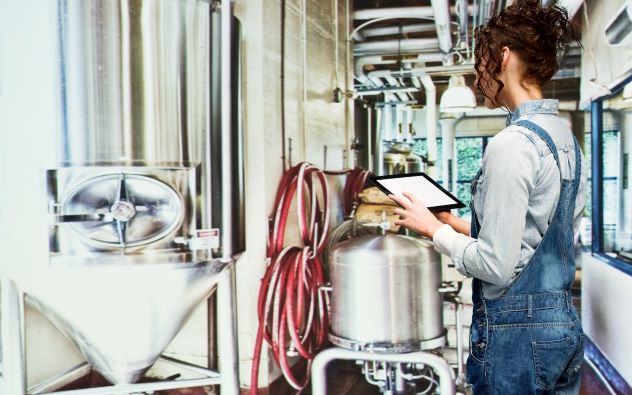 female checking equipment on tablet