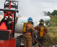 Two firefighters responding to an anhydrous ammonia release.