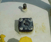 Liquid gauge mounted to a tank.