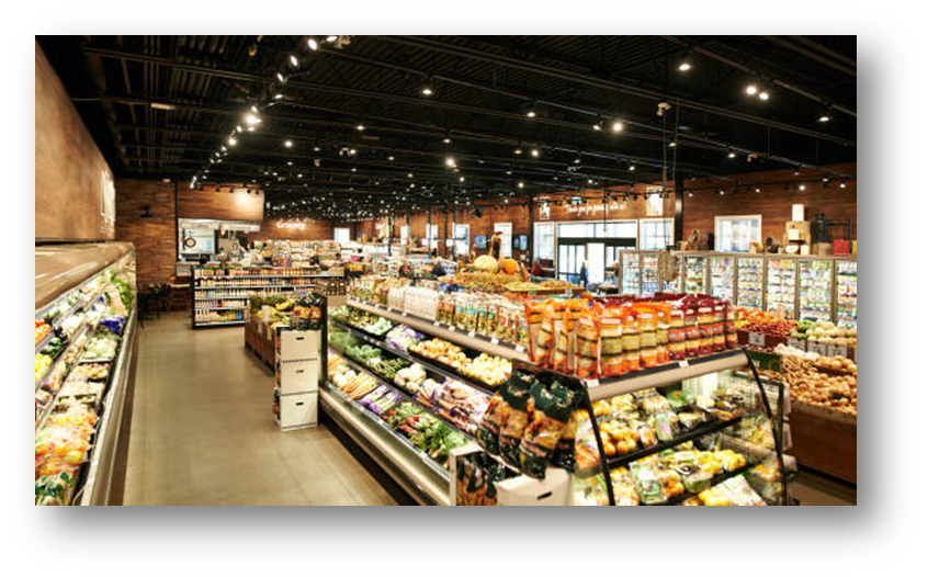 An image showing refrigerated food cases and shelving with various food products, packaged and fresh produce, stocked on them.