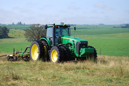 Tractor field applying manure
