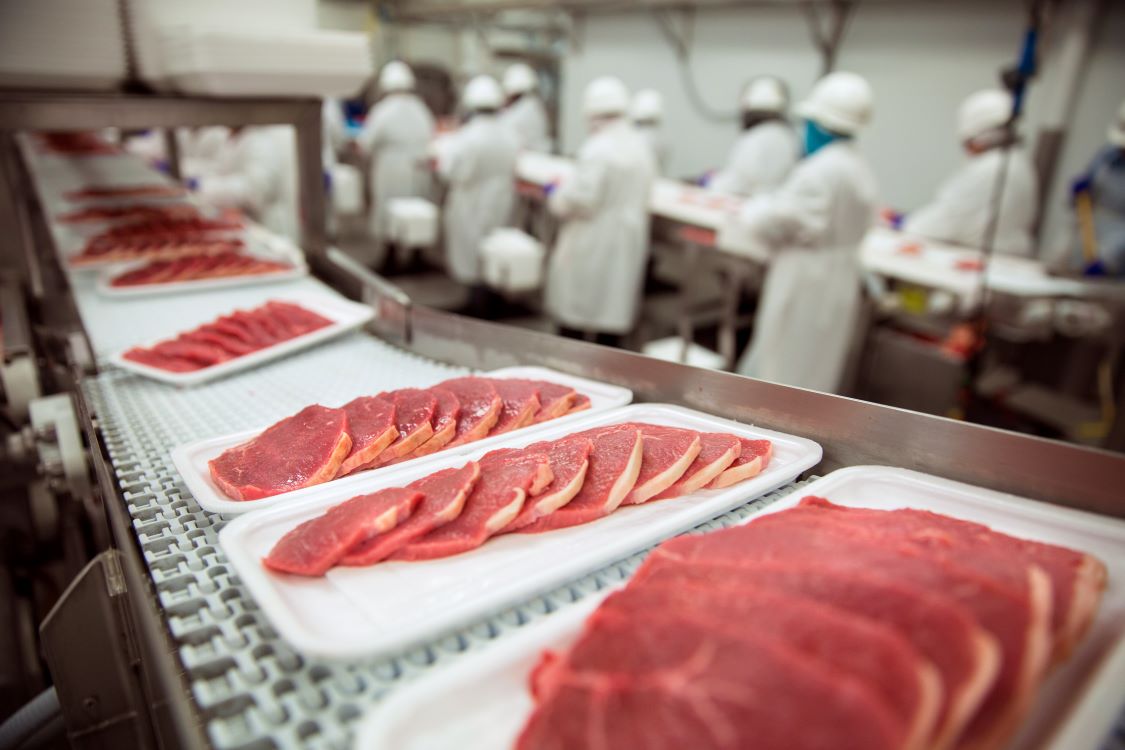 Packaging meat on at a food manufacturer