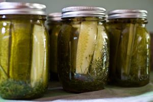 four jars of canned pickles