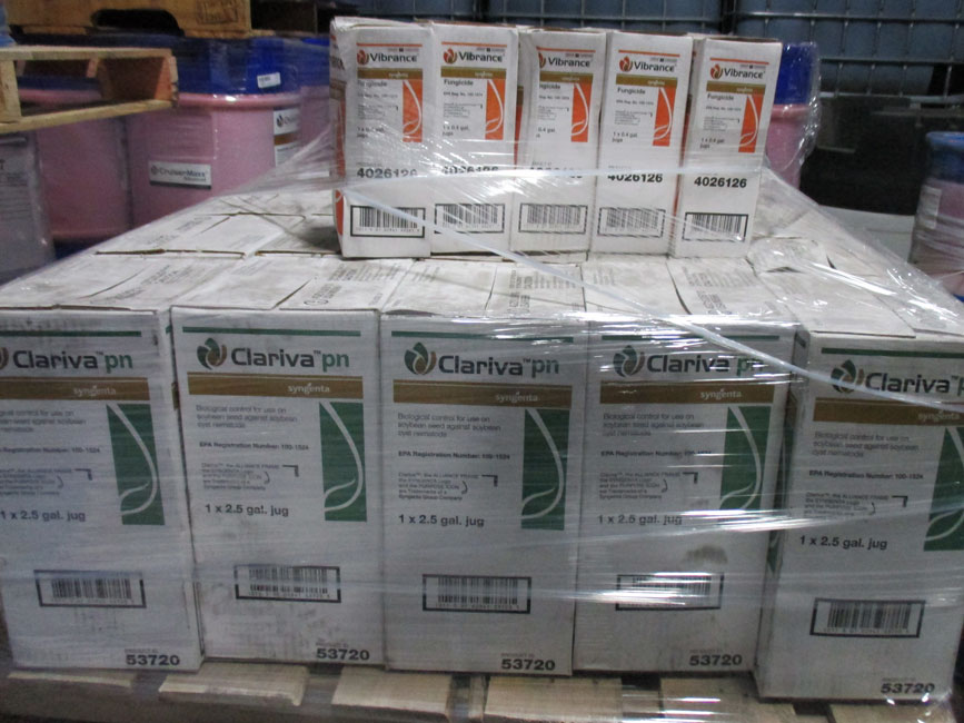 Photo shows a pallet of small package pesticides at a facility. 