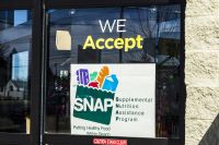 Store window displaying SNAP sign