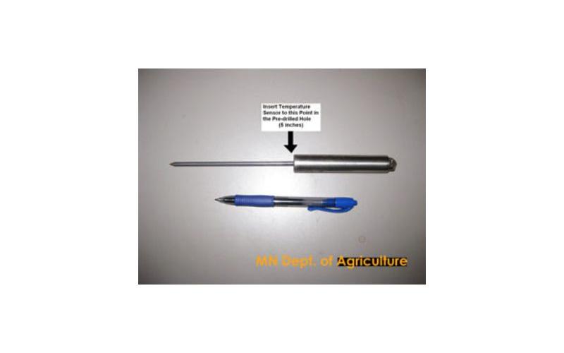 metal probe beside a blue ink pen